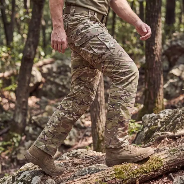 Multicam tactical pants woodland outdoor walking shot, ripstop poly cotton fabric